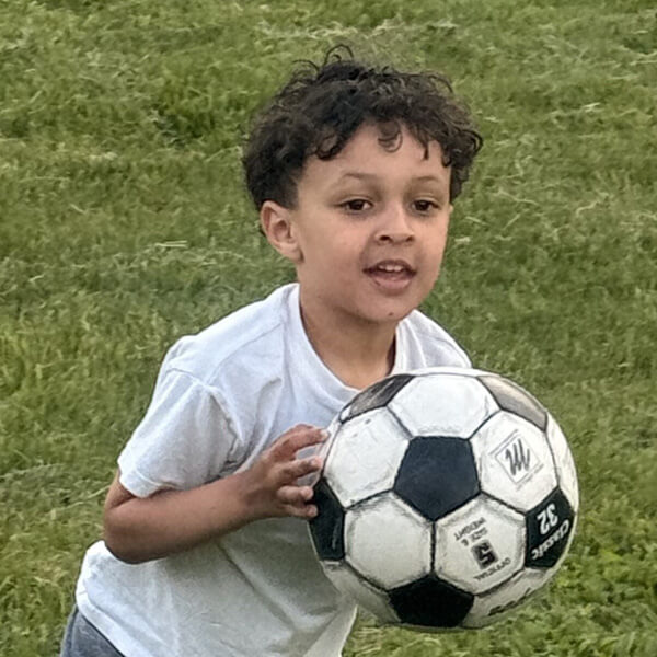 Young student with soccer ball