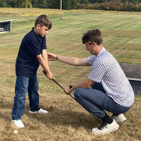 Child practicing golf